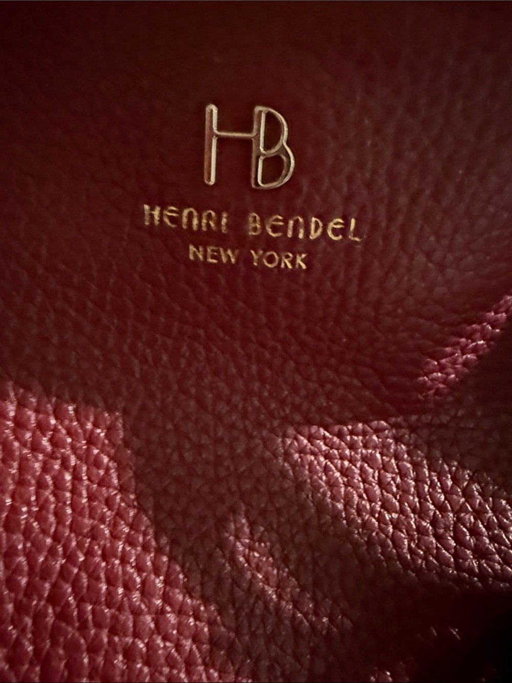 Henri Bendel tote bag features a pebbled texture and gold-toned hardware. - Picture 2 of 11
